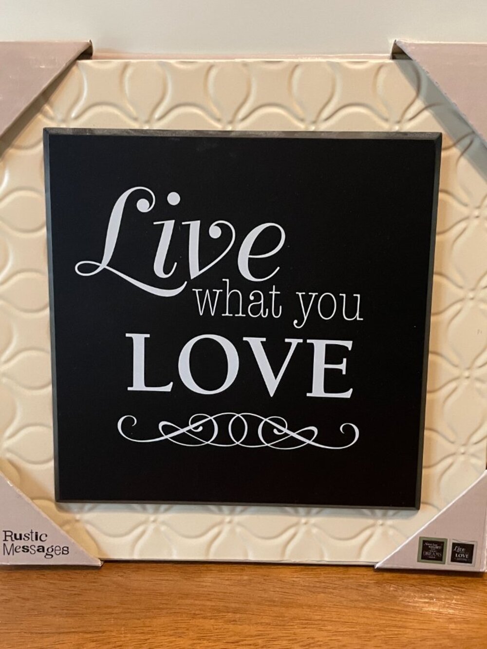 "Live what you Love" black rustic message on embossed metal hanging plaque